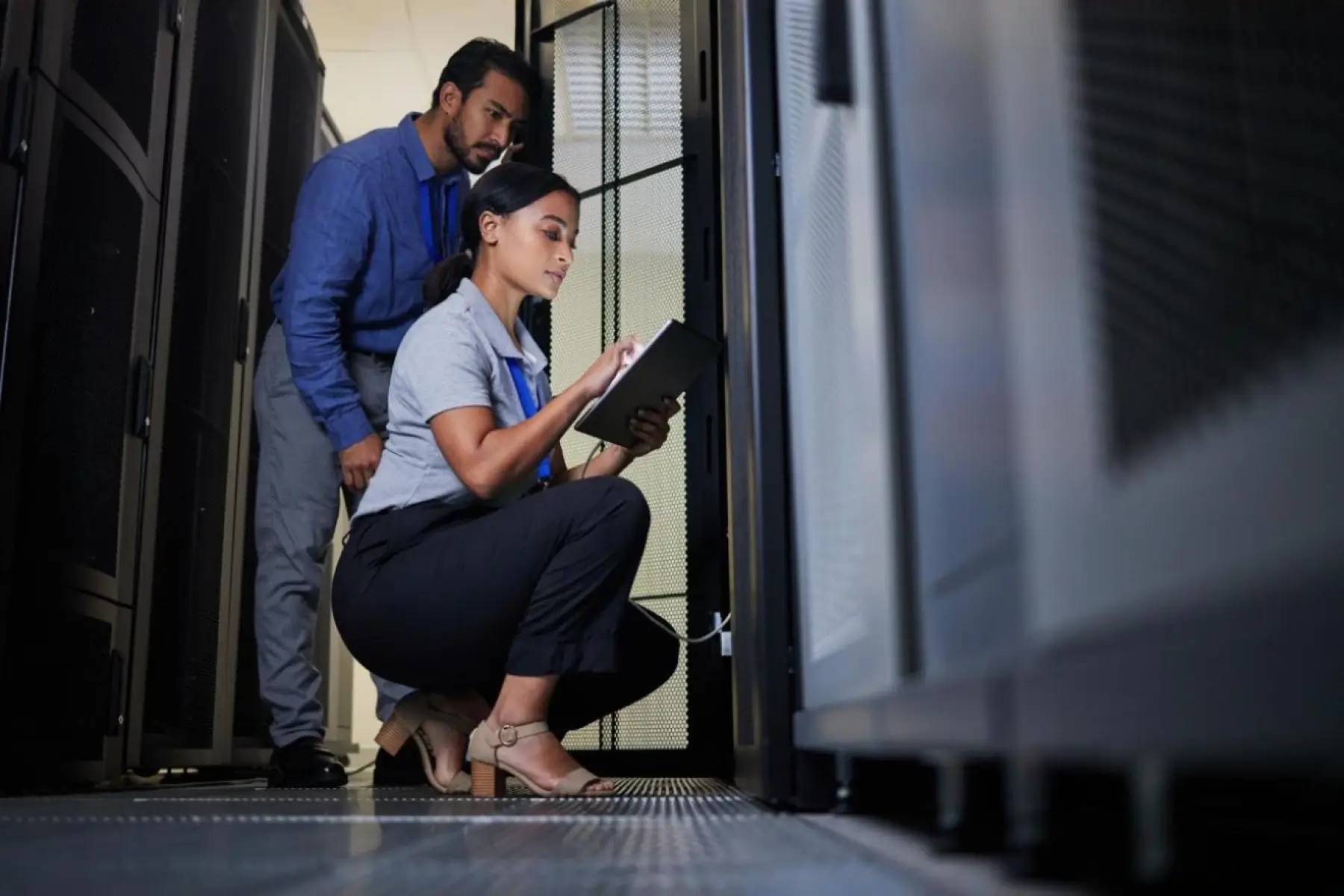 it-implementation-migration young joyful business people working